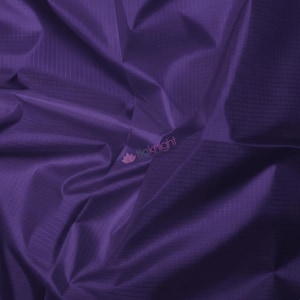 May include: A close-up of a deep purple fabric with a subtle grid pattern. The fabric is draped, creating soft folds and shadows. The texture appears smooth and slightly shiny, suggesting a lightweight material. The logo "liaknight" is visible in the bottom right corner.