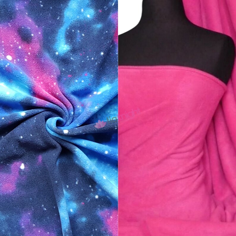 May include: Two pieces of fleece fabric. One piece is a blue and pink galaxy print. The other piece is solid pink.