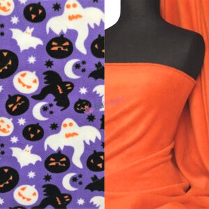 May include: Purple fleece fabric with a Halloween print featuring white ghosts, black bats, and orange pumpkins. A solid orange fleece fabric is shown next to the printed fabric.