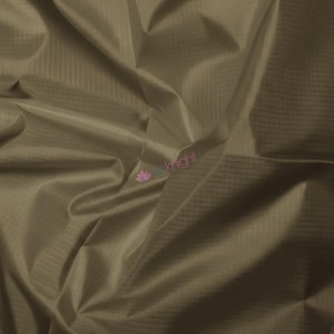 May include: Close-up of a folded, olive-green fabric with a subtle grid pattern. The fabric has a slight sheen, and the folds create shadows and highlights. The material appears lightweight and possibly water-resistant, suitable for various crafting projects.
