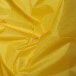 May include: Close-up of a bright yellow fabric with a subtle grid pattern. The material is smooth and appears to be lightweight, with folds and creases adding texture. The overall impression is of a vibrant, sunny textile.