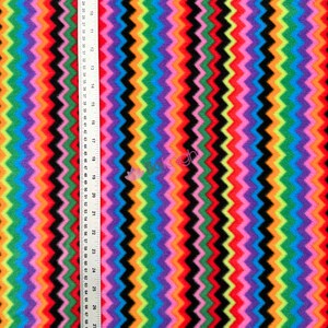 May include: Multicolored chevron patterned fleece fabric. The fabric features alternating stripes of pink, orange, yellow, green, blue, purple, and black.