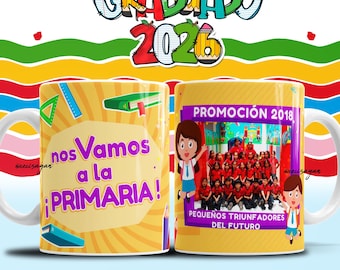 May include: A white ceramic mug featuring a yellow background with school-themed graphics. One side displays the text 'nos Vamos a la PRIMARIA!' with books and rulers. The other side shows a group photo labeled 'PROMOCIÓN 2018' and 'PEQUEÑOS TRIUNFADORES DEL FUTURO'.