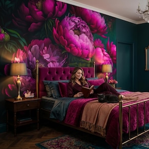 May include: A bedroom featuring a brass bed frame with a tufted magenta headboard, layered with dark teal and magenta bedding. A large floral wallpaper mural with vibrant pink peonies covers the wall behind the bed, complemented by dark teal walls.