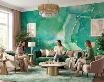 May include: A living room featuring a large emerald green and gold marble-patterned wall mural, a tufted dark green sofa, a cream armchair, a pink velvet chair, a round marble coffee table with a gold base, and a gold tiered crystal chandelier.