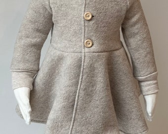 Walk coat with a full skirt, buttons, and a pointed cap in light beige (also available in other walk colors and with a zipper)
