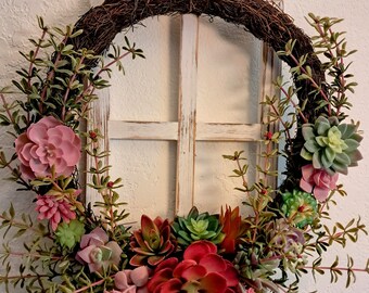 Succulent Spring wreath Sedum wreath with red, pink and yellow accents. 18" diameter, approximately. Mounted on wood window.