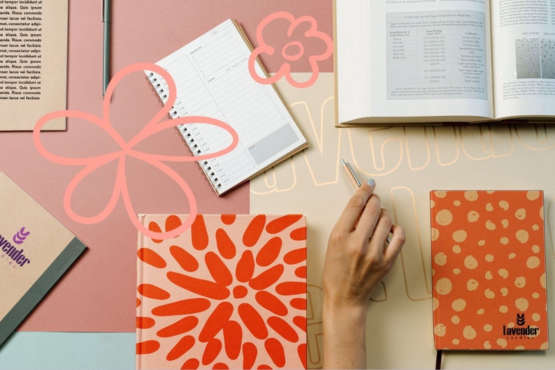 May include: A flat lay of a desk with various notebooks, pens, and a book. The notebooks have different patterns, including orange and red polka dots, and a floral design. The book is open to a page with a table of data. The desk is covered in a light brown surface.