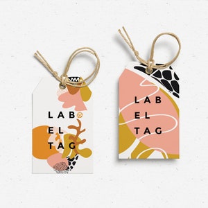 以下が含まれることがあります： 黒い文字で「LABEL TAG」と書かれた、抽象的なデザインのギフトタグ2枚。タグはピンク、イエロー、ブラックで、抽象的な形と線が描かれている。