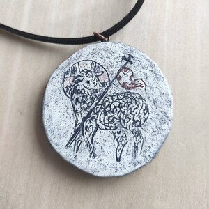Lamb symbol of Christ. A symbol of the suffering, death and resurrection of Jesus Christ. Wooden souvenir.  Miniature icon. Orthodox icon.