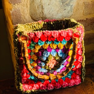 Crocheted chenille granny square bag.