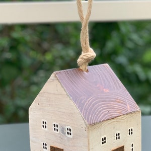Wooden house doorstop or bookend.