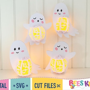 May include: Four white ghost cut files with yellow pumpkin designs. The ghosts are holding the pumpkins in their hands. The text "Bees Knees SVG" is at the bottom of the image.