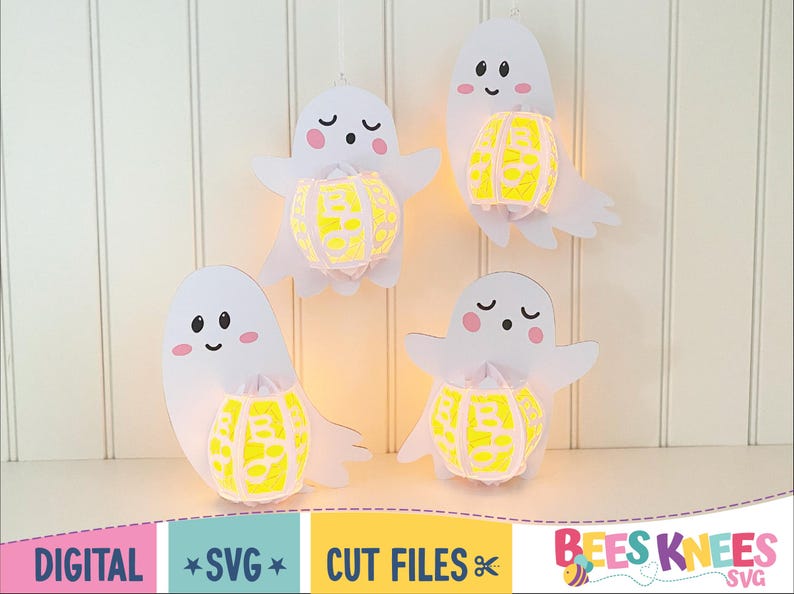 May include: Four white ghost cut files with yellow pumpkin designs. The ghosts are holding the pumpkins in their hands. The text "Bees Knees SVG" is at the bottom of the image.