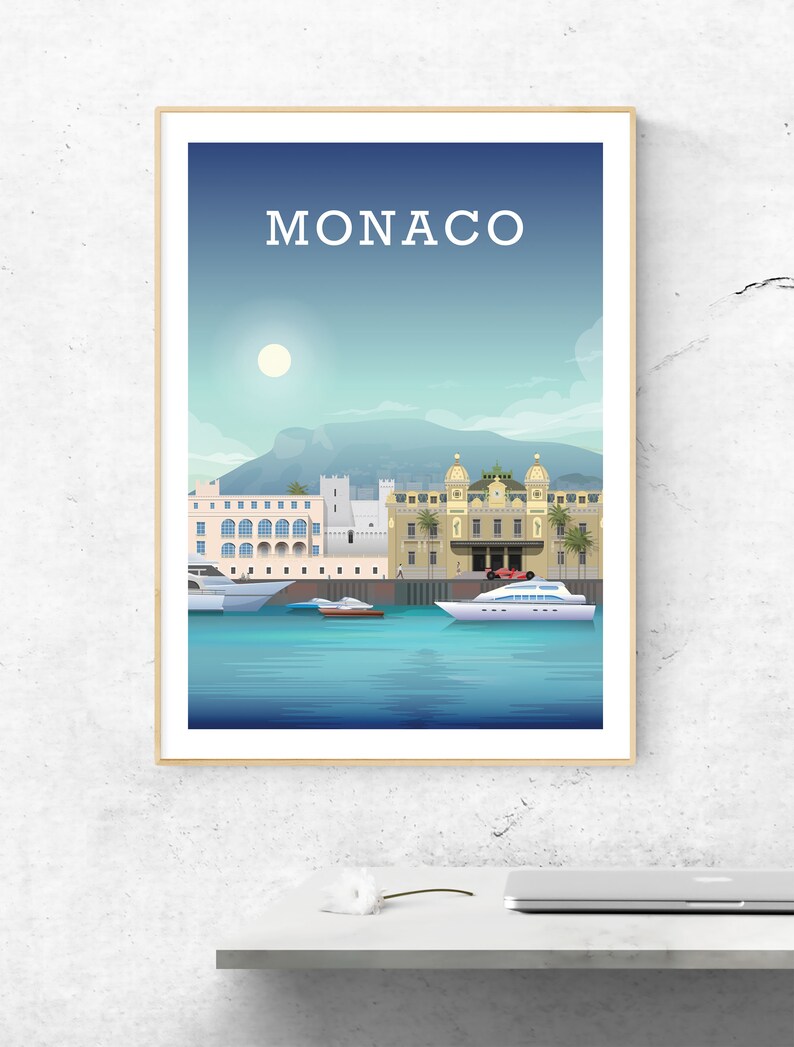 May include: A colorful illustration of the Monaco cityscape with the text "MONACO" at the top. The illustration features buildings, a mountain, a harbor, and boats.