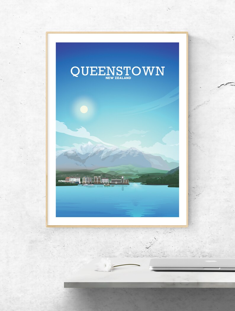 May include: A framed illustration of Queenstown, New Zealand, with a blue sky, white clouds, a sun, mountains, a lake, and a town.