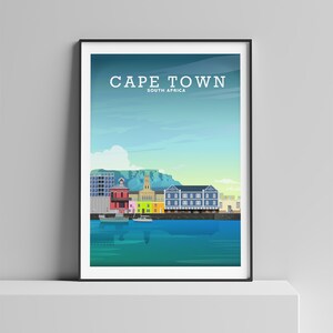 May include: A colourful illustration of the Cape Town skyline, featuring the iconic Table Mountain, colourful buildings, and a harbour with boats. The text "CAPE TOWN" and "SOUTH AFRICA" is displayed at the top of the image.
