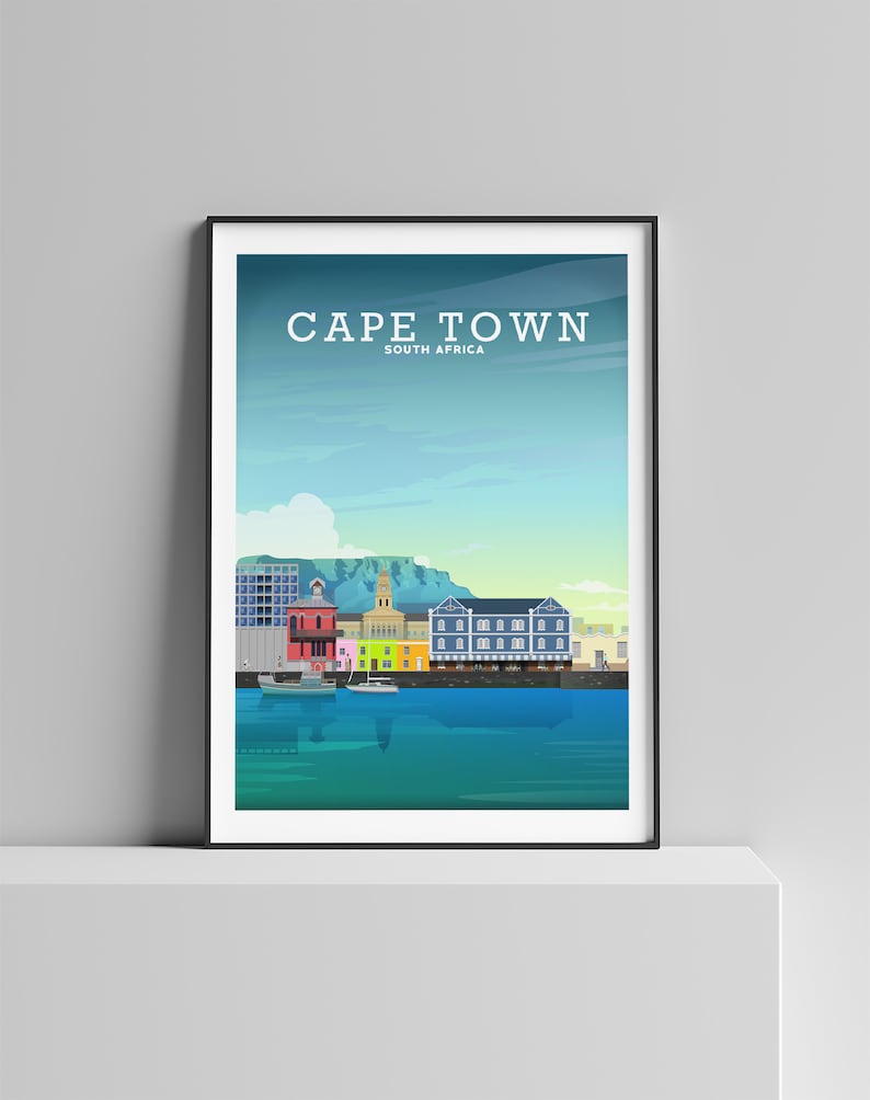 May include: A colourful illustration of the Cape Town skyline, featuring the iconic Table Mountain, colourful buildings, and a harbour with boats. The text "CAPE TOWN" and "SOUTH AFRICA" is displayed at the top of the image.