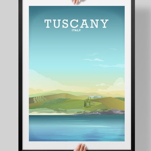 May include: A poster with a blue sky and green hills, with the text "Tuscany, Italy" at the top.