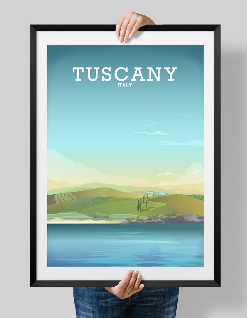 May include: A poster with a blue sky and green hills, with the text "Tuscany, Italy" at the top.