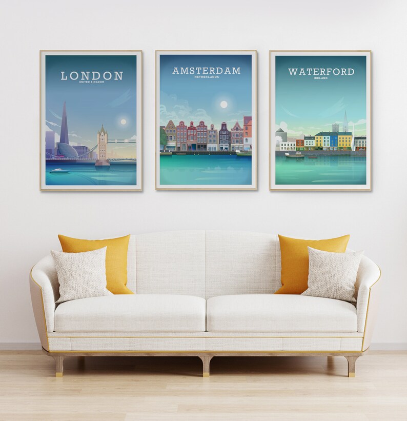 May include: Three framed city skyline posters with a white background. The posters feature illustrations of London, Amsterdam, and Waterford. Each poster has the city name and country at the top.