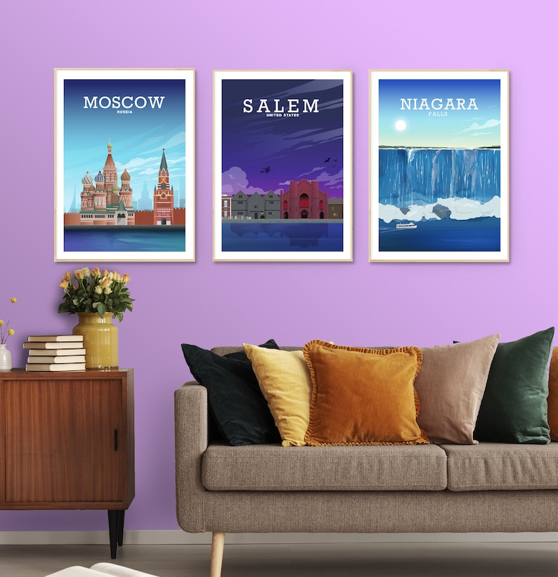 May include: Three framed prints of cityscapes. The left print shows the St. Basil's Cathedral in Moscow, Russia. The middle print shows a red building in Salem, Massachusetts, USA. The right print shows Niagara Falls.