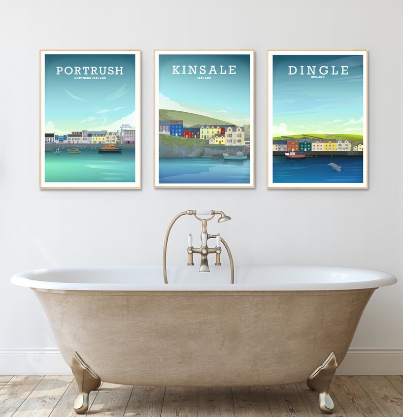 May include: Three framed prints of coastal towns in Ireland. The prints feature illustrations of the towns of Portrush, Kinsale, and Dingle. Each print has a blue background with a white border.