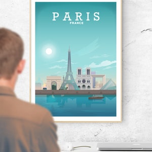 Peut inclure: Une affiche encadr&eacute;e repr&eacute;sentant une ville de Paris, France, en bleu et vert. La tour Eiffel est le monument le plus important de l'image. L'affiche porte le texte "PARIS FRANCE" en haut.