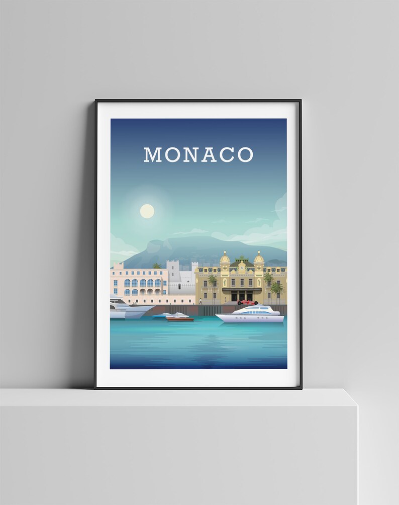 May include: A colorful illustration of the Monaco skyline with the text "MONACO" at the top. The illustration features buildings, a harbor, and boats. The sky is blue with a white sun.