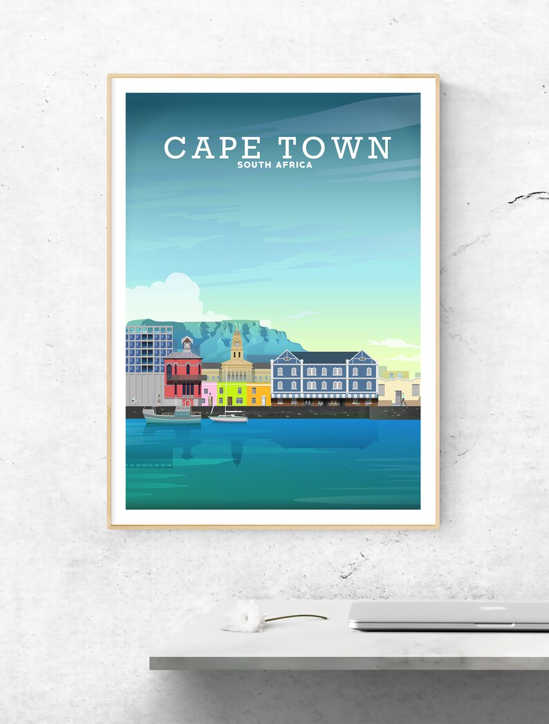 May include: A colourful illustration of the Cape Town skyline, featuring the iconic Table Mountain, a harbour with boats, and colourful buildings. The text "CAPE TOWN" and "SOUTH AFRICA" is displayed at the top of the image.