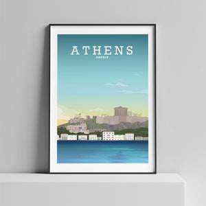 May include: A poster with a blue, green, and white illustration of the Acropolis in Athens, Greece. The text "ATHENS" and "GREECE" is printed in white at the top of the poster.
