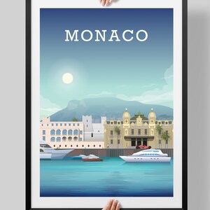 May include: A colorful illustration of the Monaco skyline with the text "MONACO" at the top. The illustration features buildings, palm trees, a yacht, and a red sports car.