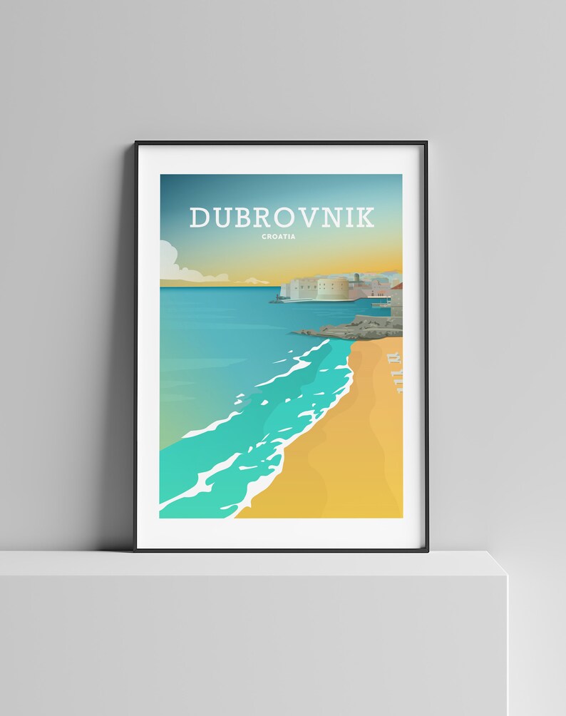 May include: Framed art print featuring a coastal scene of Dubrovnik, Croatia. The artwork depicts a beach with turquoise waves, a golden sand shore, and a city skyline under a blue and yellow sky. The word "Dubrovnik" is printed at the top.