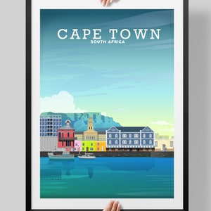 May include: A colourful illustration of the Cape Town skyline, featuring a waterfront with boats, buildings, and Table Mountain in the background. The text "CAPE TOWN" and "SOUTH AFRICA" is displayed at the top of the image.