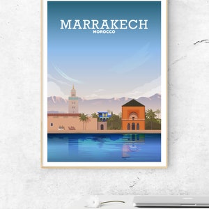 May include: A colorful illustration of the city of Marrakech, Morocco. The illustration features a mosque, a building with a red roof, and a reflection of the city in a pool of water. The text "MARRAKECH" and "MOROCCO" is displayed at the top of the illustration.