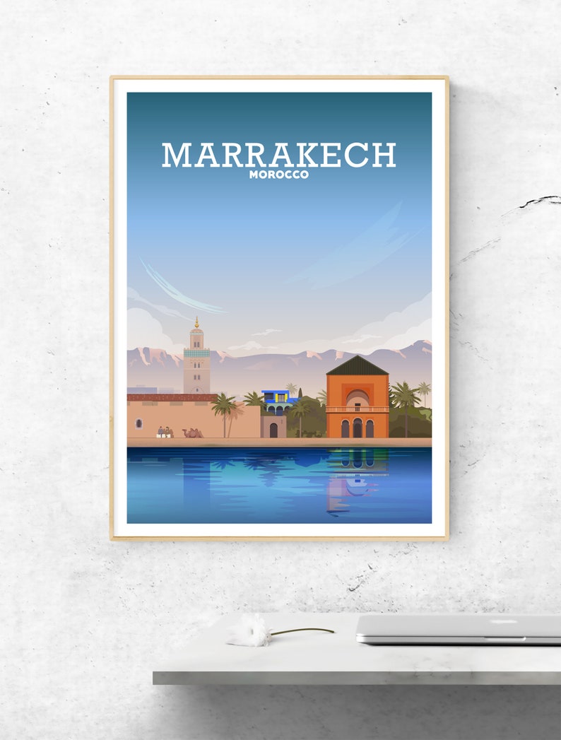 May include: A colorful illustration of the city of Marrakech, Morocco. The illustration features a mosque, a building with a red roof, and a reflection of the city in a pool of water. The text "MARRAKECH" and "MOROCCO" is displayed at the top of the illustration.