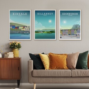 May include: Three framed illustrations of cityscapes. The first shows Kinsale, Ireland, with colourful buildings and a boat in the water. The second shows Killarney, Ireland, with a green hill and a lake. The third shows Edinburgh, Scotland, with a castle and a street scene.