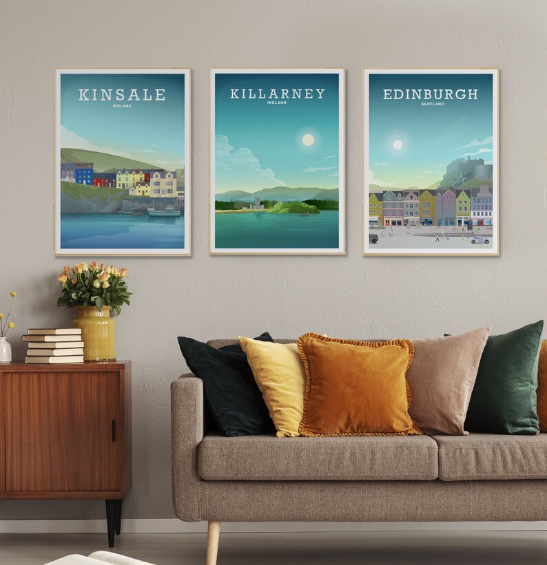 May include: Three framed illustrations of cityscapes. The first shows Kinsale, Ireland, with colourful buildings and a boat in the water. The second shows Killarney, Ireland, with a green hill and a lake. The third shows Edinburgh, Scotland, with a castle and a street scene.