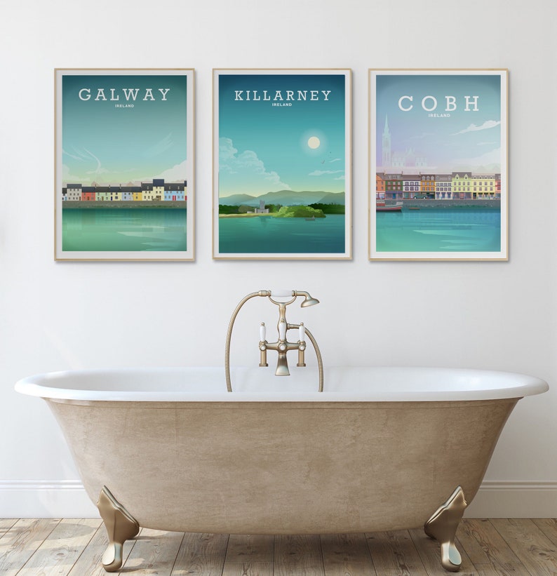 May include: Three framed prints of Irish cities, Galway, Killarney, and Cobh, with a white background and a bathtub in the foreground.