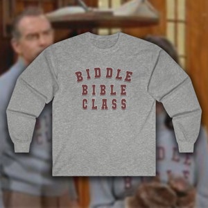 May include: Gray long-sleeve shirt with the text "BIBLE CLASS" in a maroon varsity-style font.