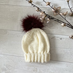 HANDKNITTED *Brand New* Aran Weight, Baby Faux Fur Bobble Hat ~ Ecru ~ 0-3 Months