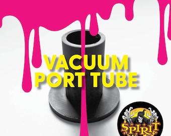 May include: Black plastic vacuum port tube with the text "VACUUM PORT TUBE" in yellow letters. The tube is sitting on a white surface with pink paint dripping down the sides.
