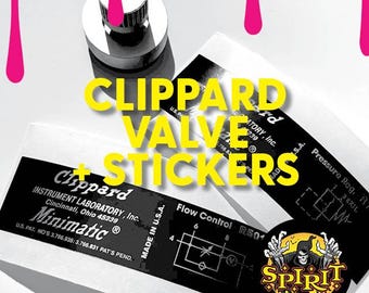 May include: A black and white image of a Clippard valve and stickers. The valve is a small, round object with a black and white label that reads "Clippard Instrument Laboratory, Inc. Cincinnati, Ohio 45239 Minimatic® U.S. PAT. NO'S 3.766.935: 3.766.831 PAT'S PEND." The stickers are black and white with yellow text. One sticker reads "Flow Control R501" and the other reads "Pressure Reg. R/P".