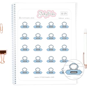May include: A sheet of 18 blue and white makeup wipe stickers. The stickers are arranged in a grid pattern and feature a simple illustration of a makeup wipe.