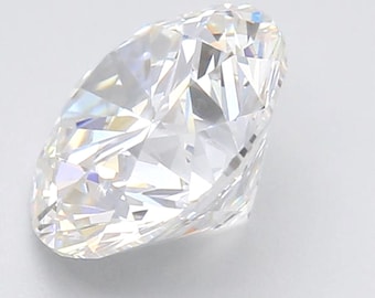 May include: A clear, round, brilliant cut diamond with many facets.