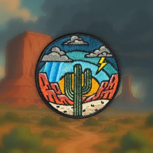 May include: Embroidered patch depicting a desert scene with a green cactus, a setting sun, and a blue sky with rain and a lightning bolt. The patch has a black border and shows red rock formations.