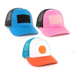 May include: Three trucker hats with mesh back panels. The first hat is blue with a black patch, the second is pink with a pink patch, and the third is white with a blue mesh panel and an orange circle.