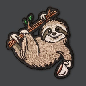 May include: A brown and tan sloth with a green leaf on its back, hanging from a brown branch. The sloth is smiling and has a cup of coffee in its hand.