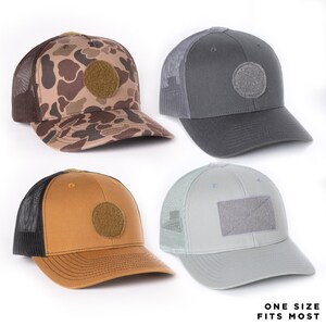 May include: Four baseball caps in various colors: camouflage, gray, tan, and light blue. Each cap features a mesh back and a patch on the front. The text "ONE SIZE FITS MOST" is displayed at the bottom.