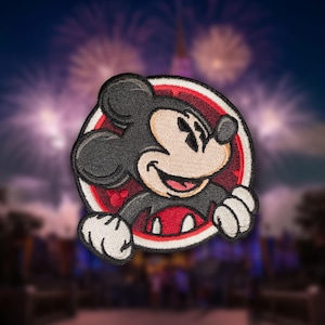May include: A red, white, and black embroidered patch featuring Mickey Mouse with a red and white circle around him.